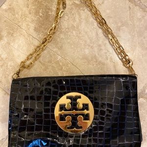 Tory Burch leather Navy Blue clutch with gold chain.